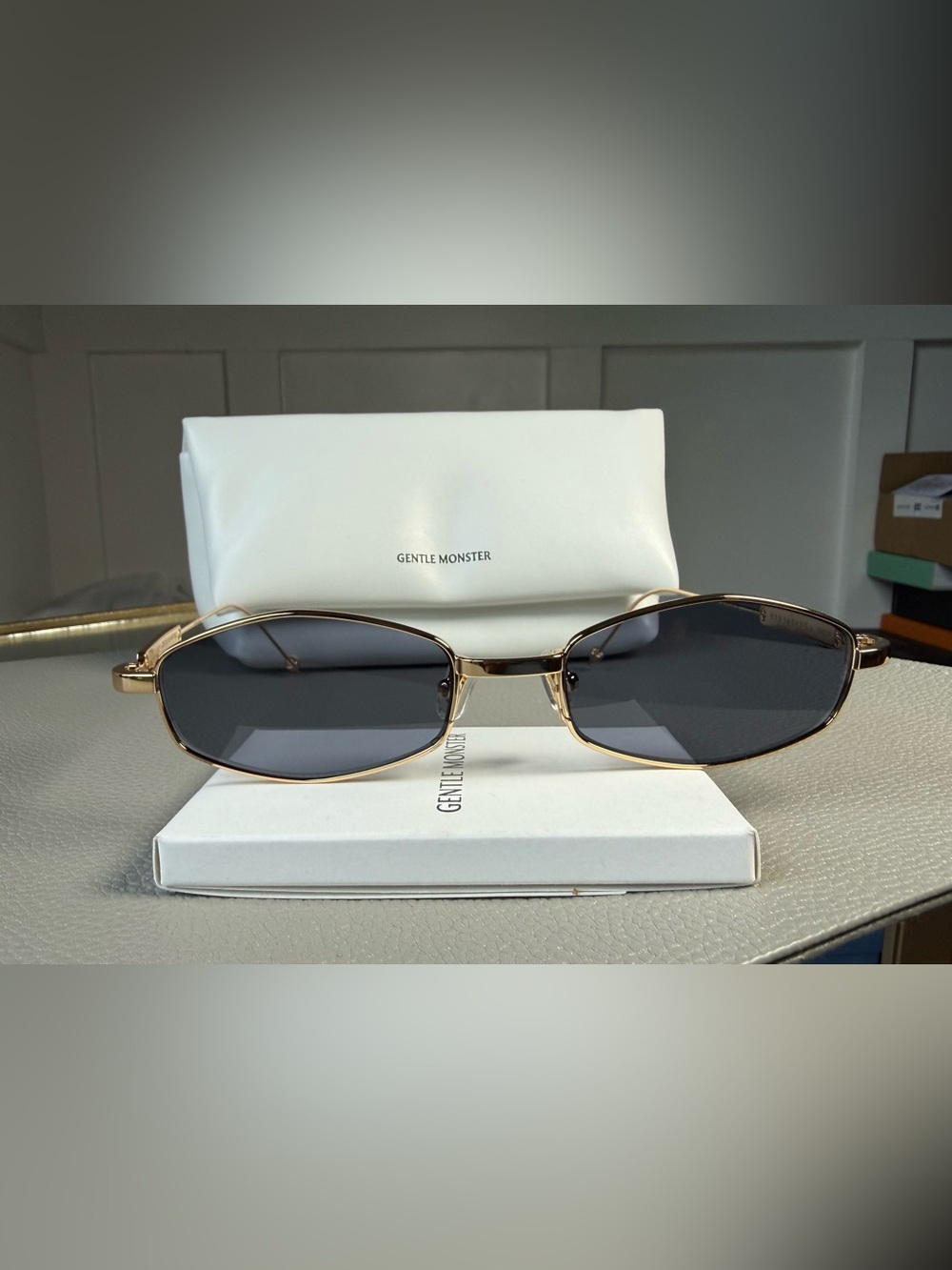 GENTLE MONSTER Gold Frame Sunglasses with Dark Gray Lenses